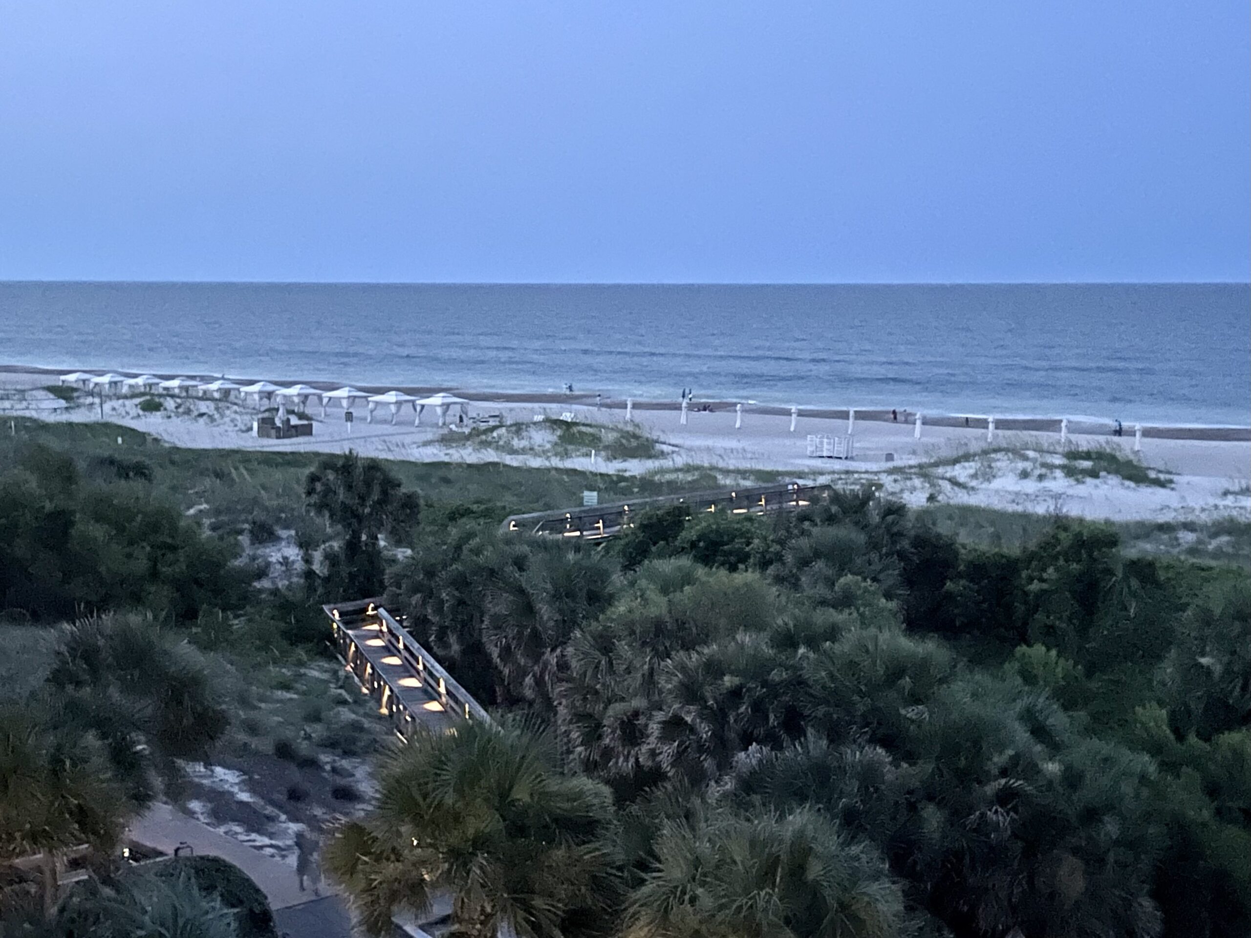 View of a beach and an ocean at sunset